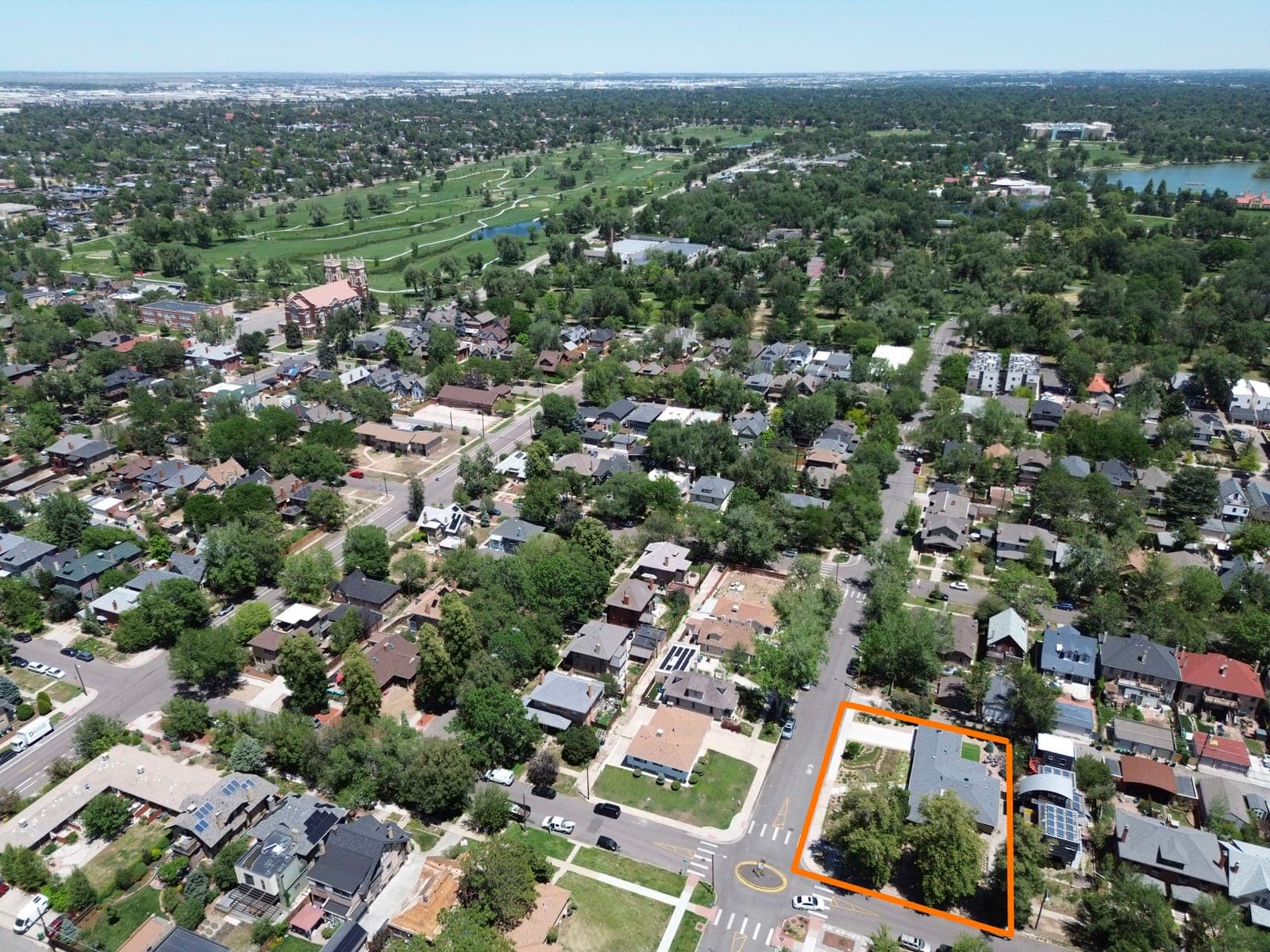 Aerial view of the outlined lot with City Park and the golf course in the distance