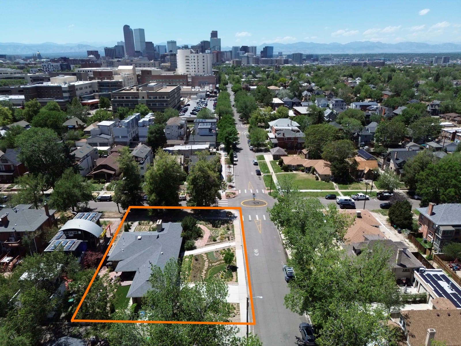 Elevated view of the outlined corner lot looking toward downtown Denver and the Front Range