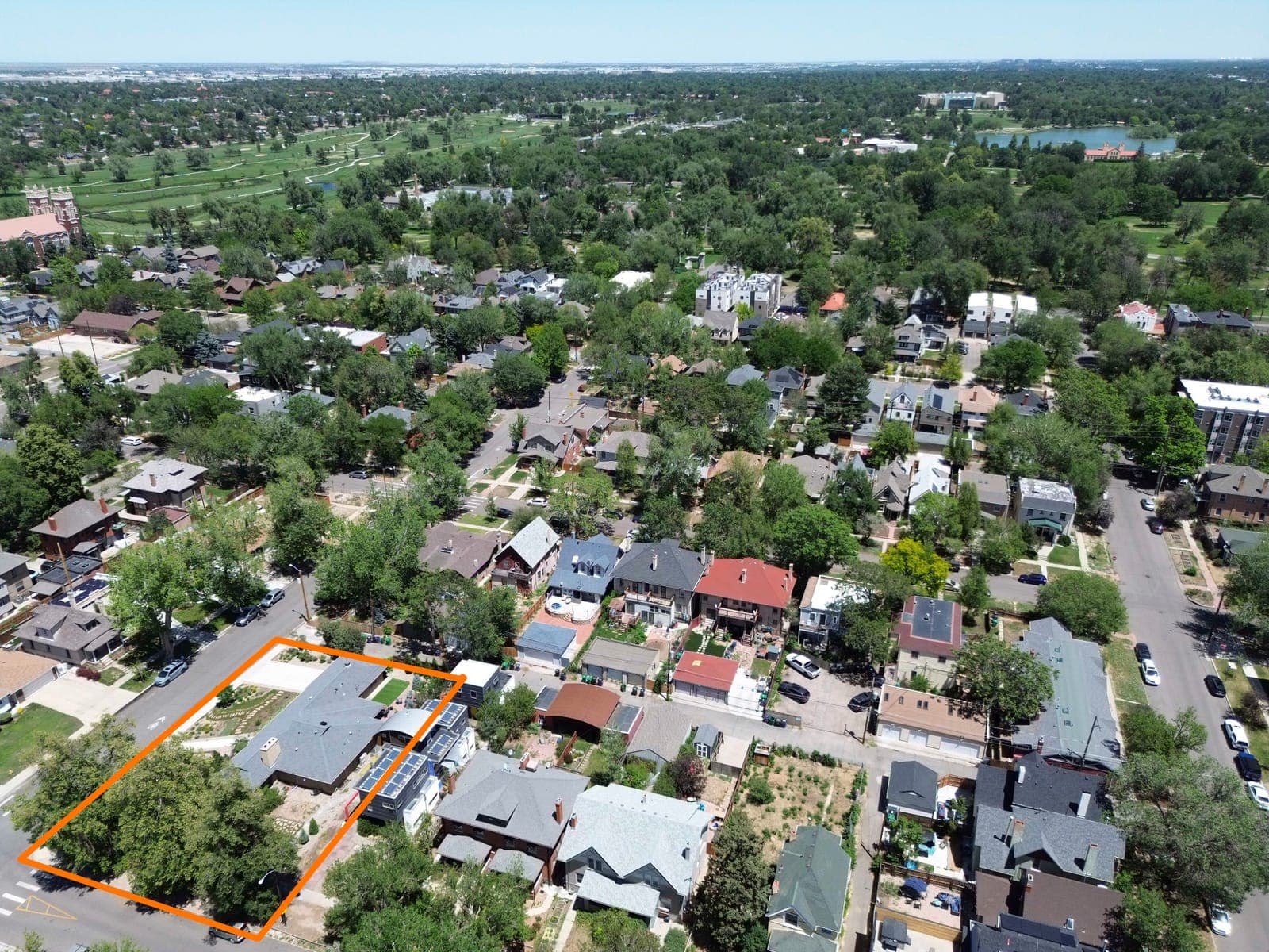 Aerial view of the outlined lot with City Park greenery in the distance