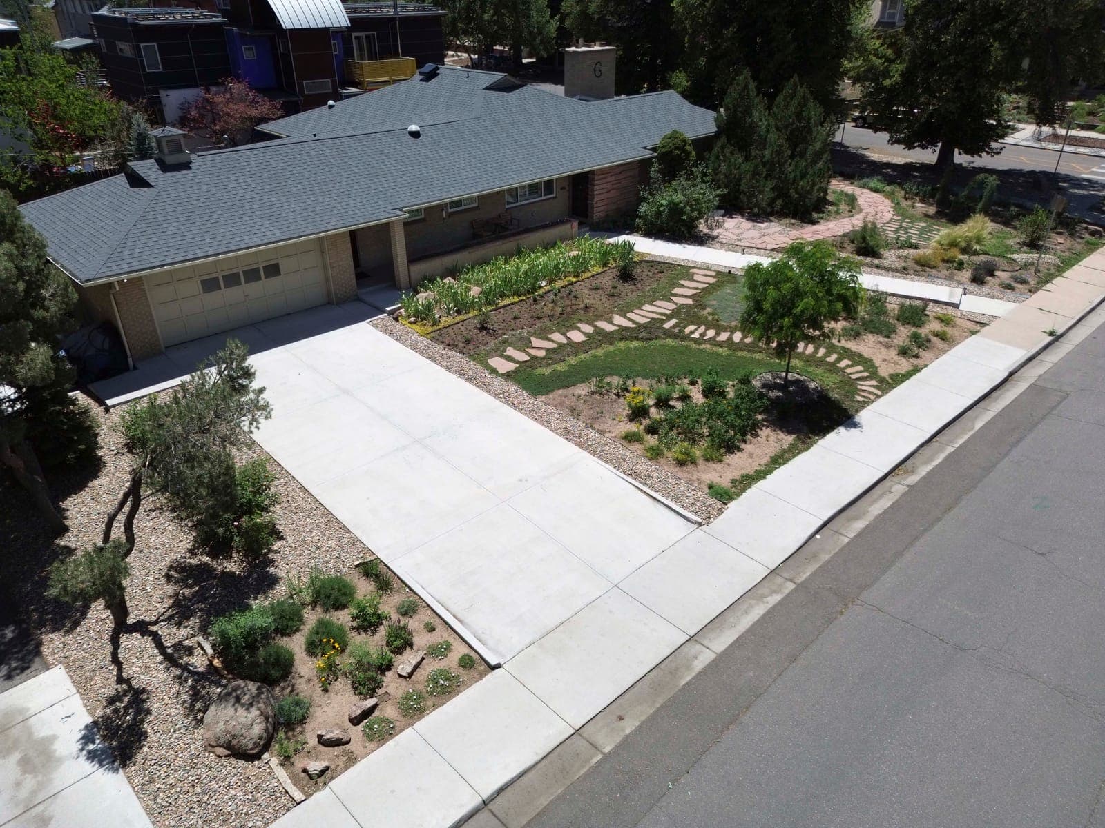 Elevated view of the driveway, front walk, and low-water garden beds