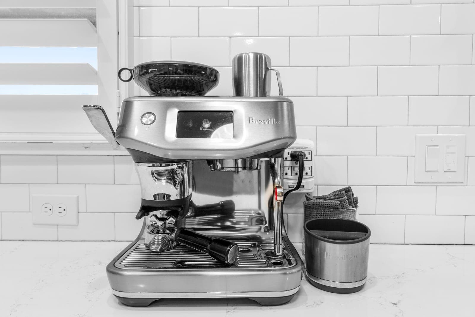 Espresso station on the quartz counter against white subway tile